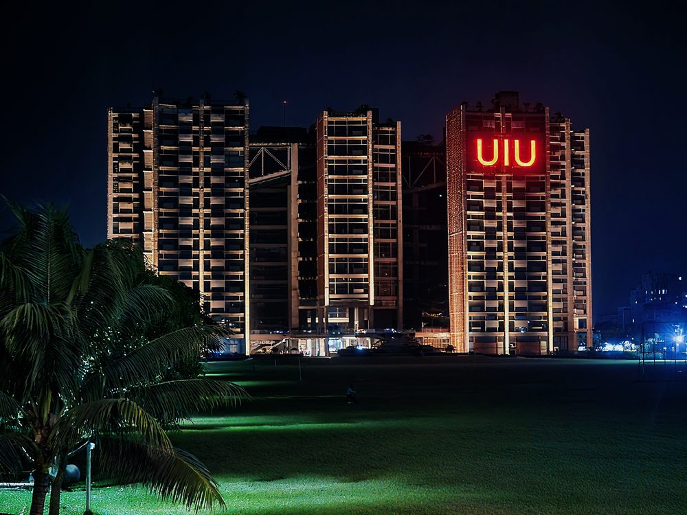 The United International University towers lit at night